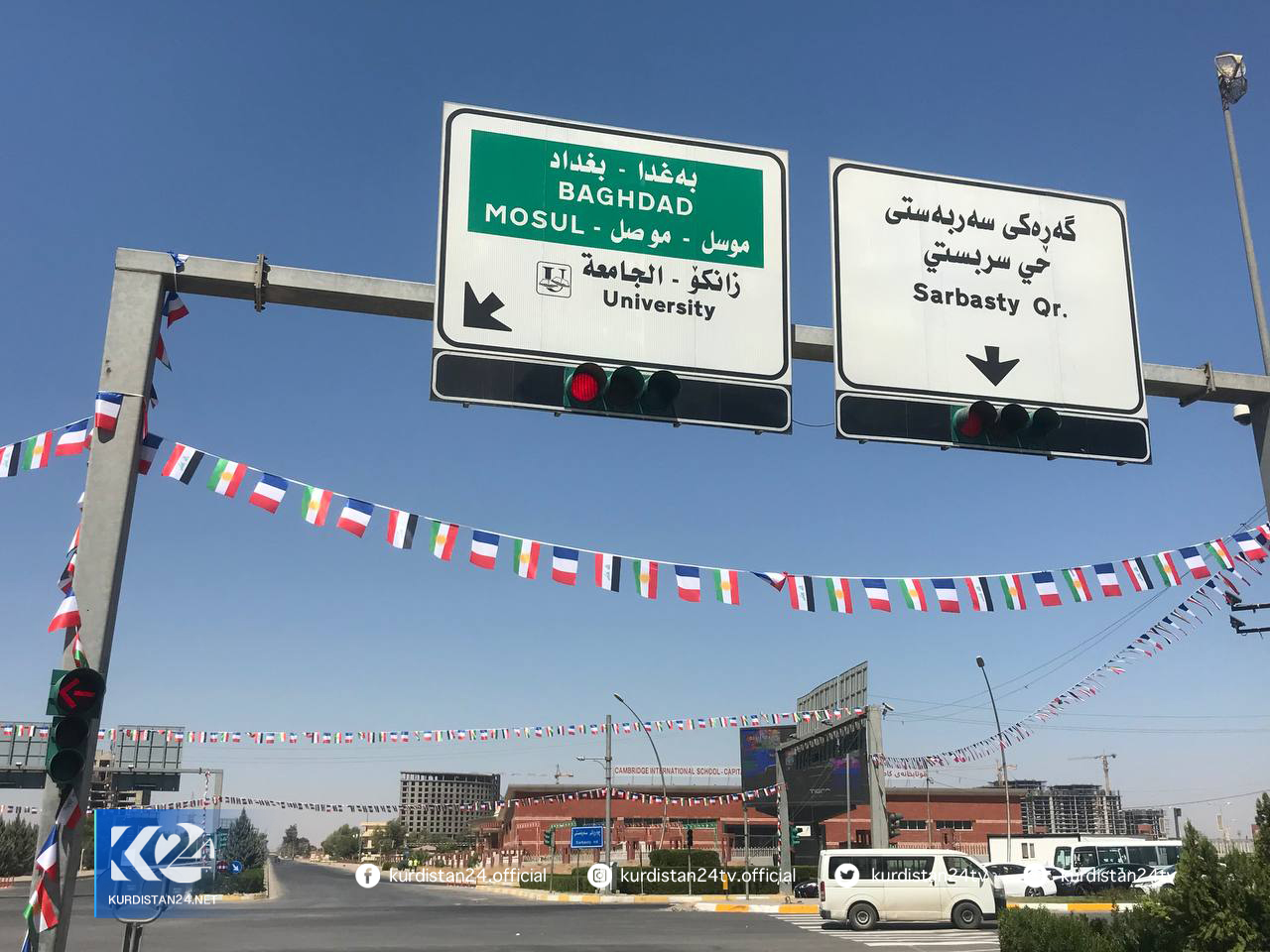 Thread flags of Kurdistan Region, France, and Iraq are hanged on a street in Erbil, August 27, 2021. (Photo: Hoshamn Sadiq/Kurdistan 24)